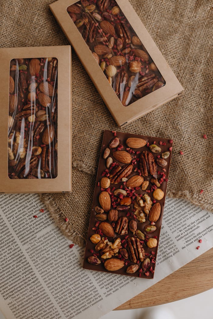 services-03 Gourmet chocolate bar with mixed nuts beautifully arranged on burlap with a rustic feel.